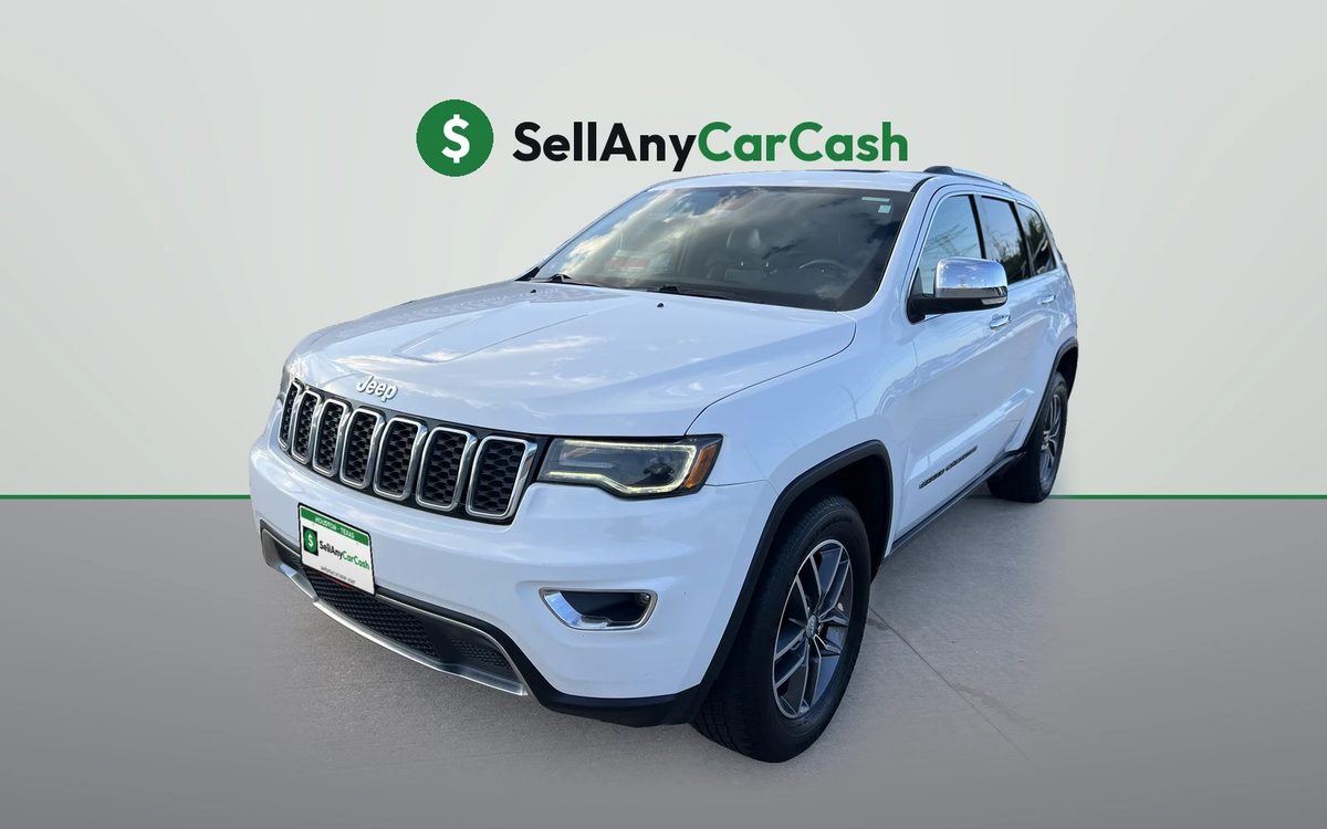 White Jeep Grand Cherokee we bought for cash in Houston, TX — Sell Any Car Cash