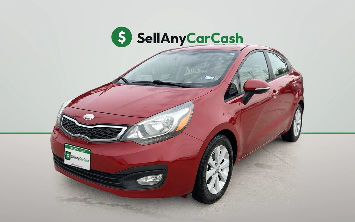Red Kia Rio we bought for cash in Houston, TX — Sell Any Car Cash
